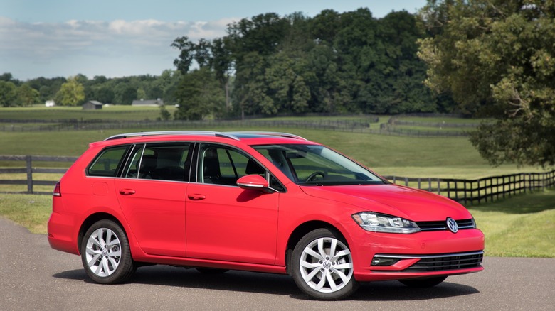 The Volkswagen Golf Sportwagen in red, front 3/4 view