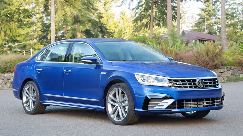 A Volkswagen Passat R-Line in blue, front 3/4 view