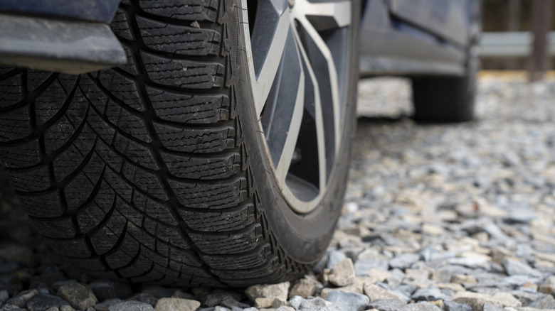 Car tires on gravel