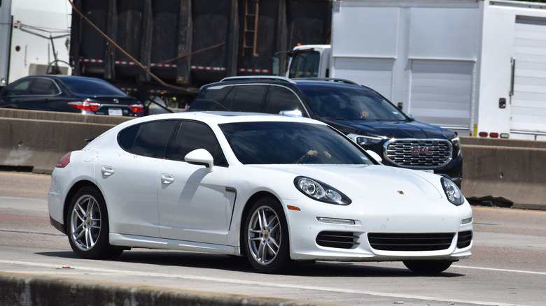 A white first generation Porsche Panamera in white, front 3/4 view