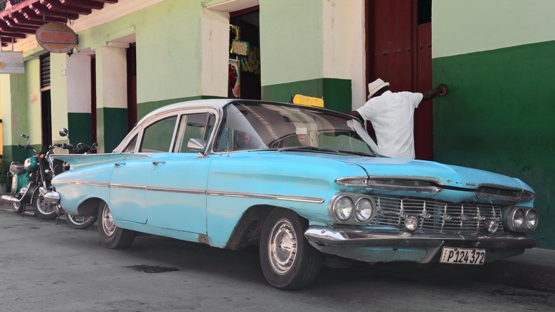 A sky blue Chevrolet Impala parked in Santiago de Cuba.