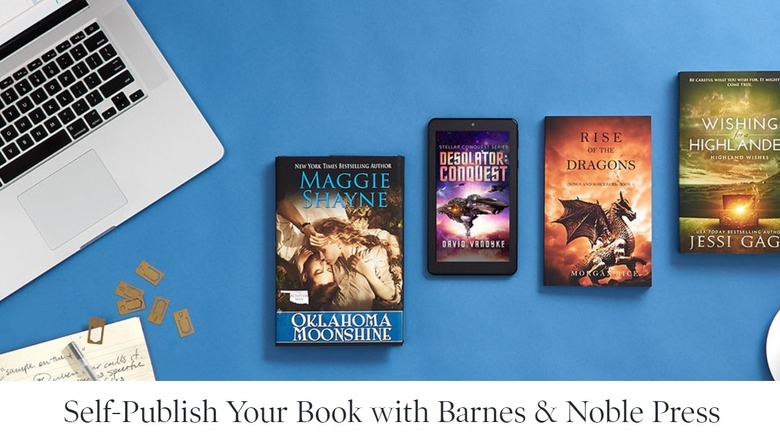 Laptop next to four attractive fantasy-style book covers