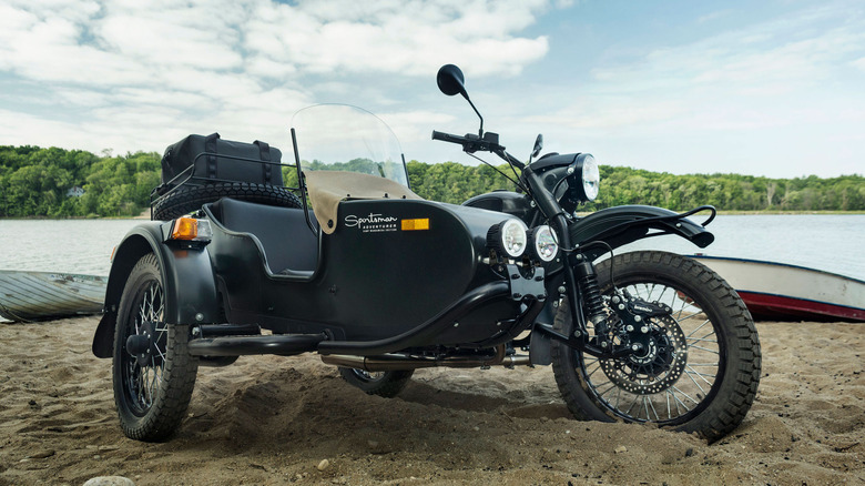 Ural motorcycle parked on sand