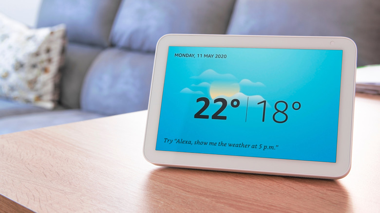 Amazon Echo Show 8 displaying the weather while it's kept on a living room table