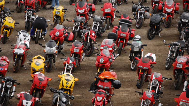 Collection of sport bikes in a dirt lot