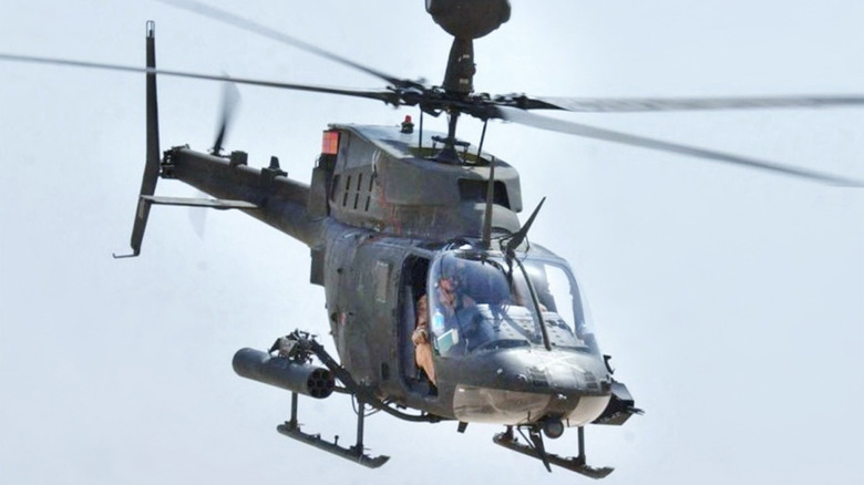 A Bell OH-58 midflight