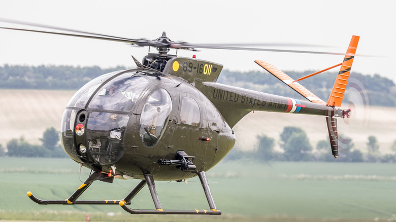 A Hughes OH-6 Cayuse mid-takeoff