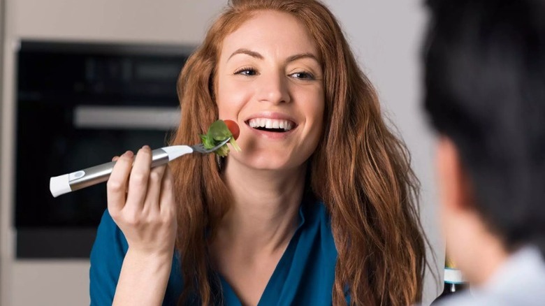 A lady with a smart fork