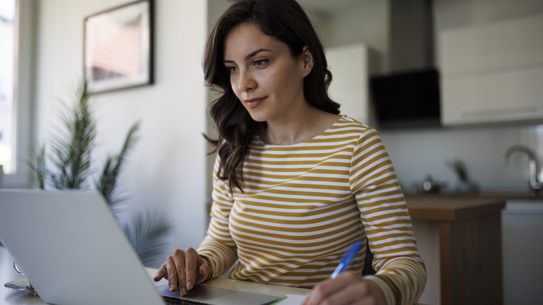 Young woman working at home