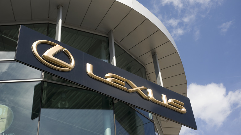 Black and gold Lexus sign