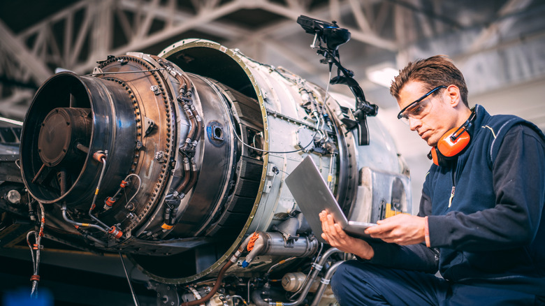 An engineer working on an aircraft