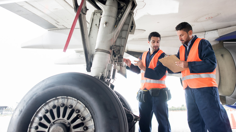 A ground crew working on a plane