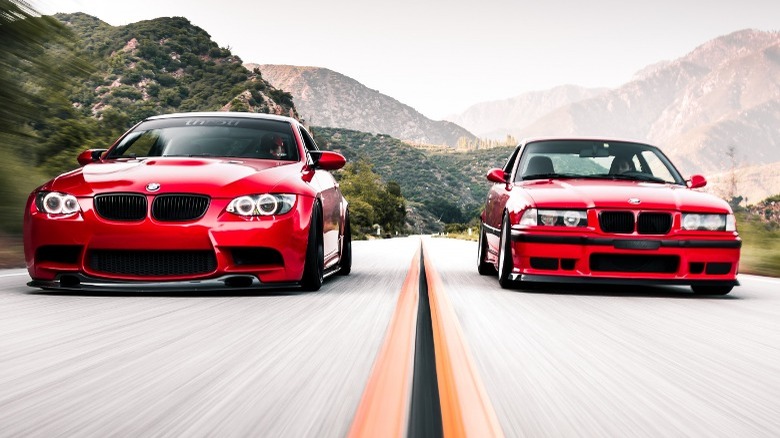 Picture of two red BMW 3 Series models from different generations