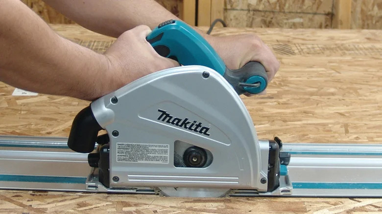 Person using Makita track saw