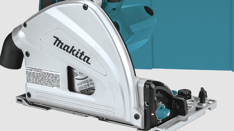 Person using Makita track saw