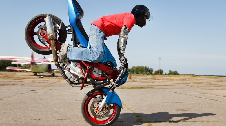 Motorcycle rider performing a Stoppie