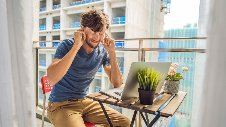 Man annoyed by noise