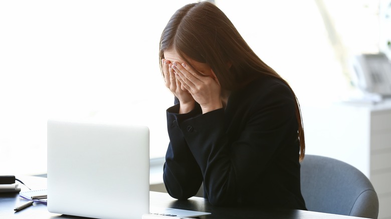 Woman crying at desk