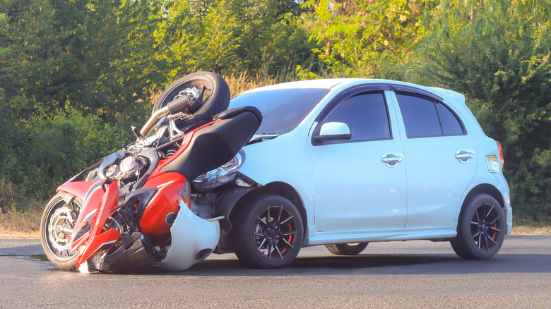 A motorcycle hit by a car.