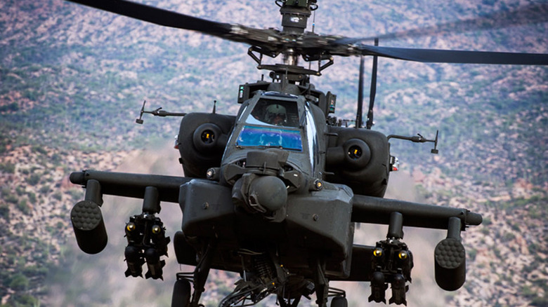 AH-64 Apache flying over the hillside