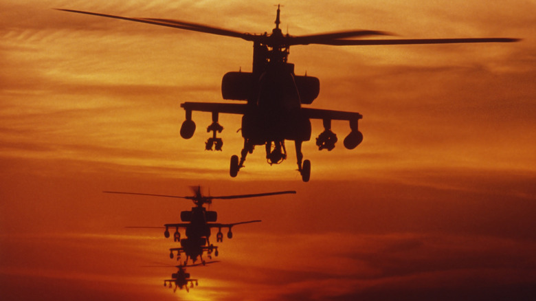 AH-64 Apache helicopters flying in formation