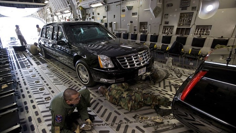 Presidential limousine in cargo hold of aircraft