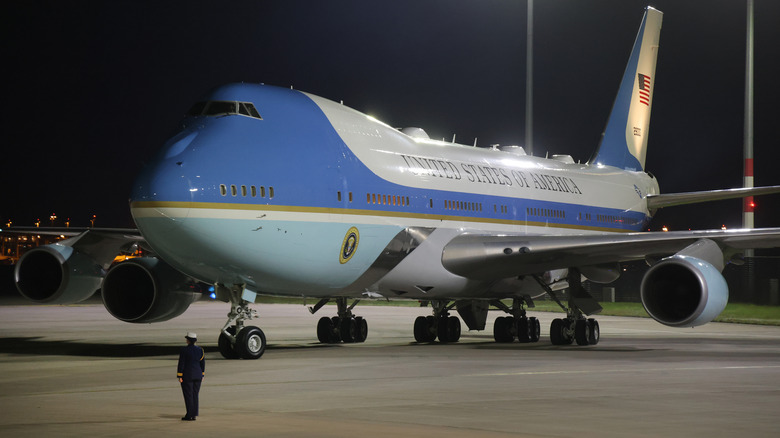 Air Force One on tarmac with guard