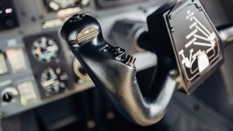 An aircraft yoke and control panel.