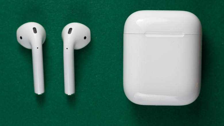 AirPods on green background