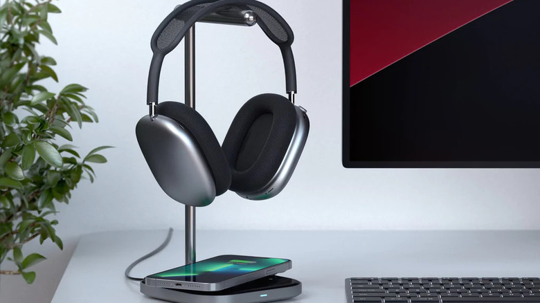 Satechi headphone stand sitting on table with AirPods Max and iPhone.