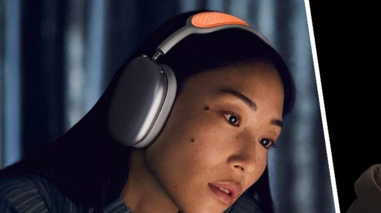 Woman listening to AirPods Max with silicon headband cover.