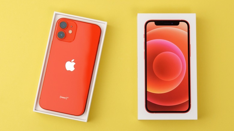 (PRODUCT)RED iPhone against yellow background