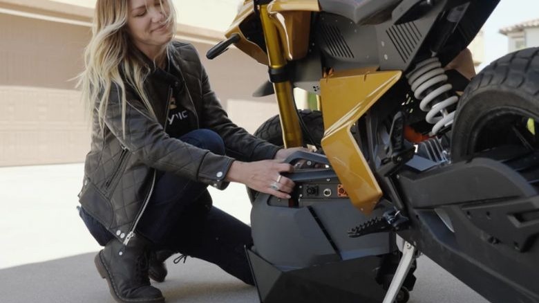 Woman removing Anthem battery pack