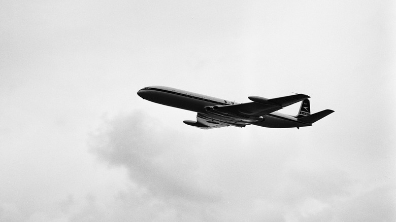 Comet aircraft against cloudy sky