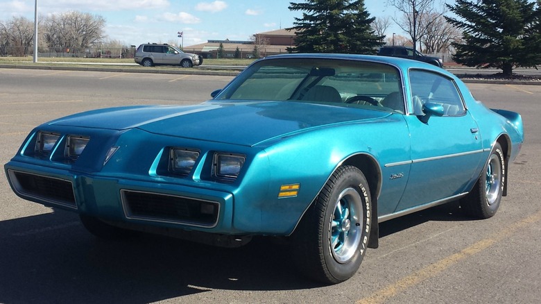 Blue 1979 Pontiac Firebird in a parking lot