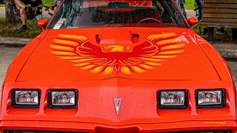 Orange 1979 Pontiac Firebird on display at a car show
