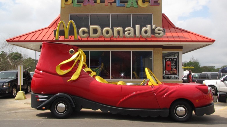 Ronald McDonald's red shoe car parked outside