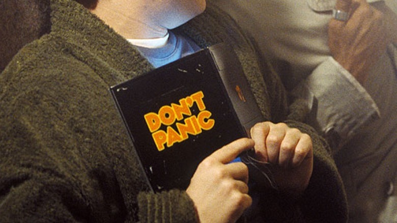 Arthur Dent holding the folding guide