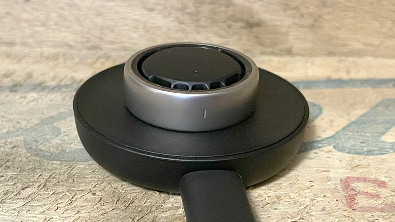 The Helio Ring placed on its wireless charging dock.