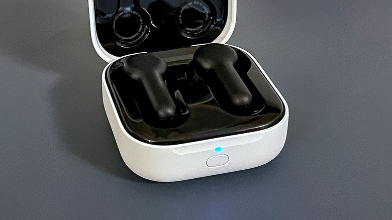 Echo Buds 2023 in charging case with blue pairing light on