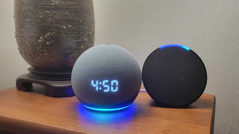 Amazon Echo pop next to an Echo Dot