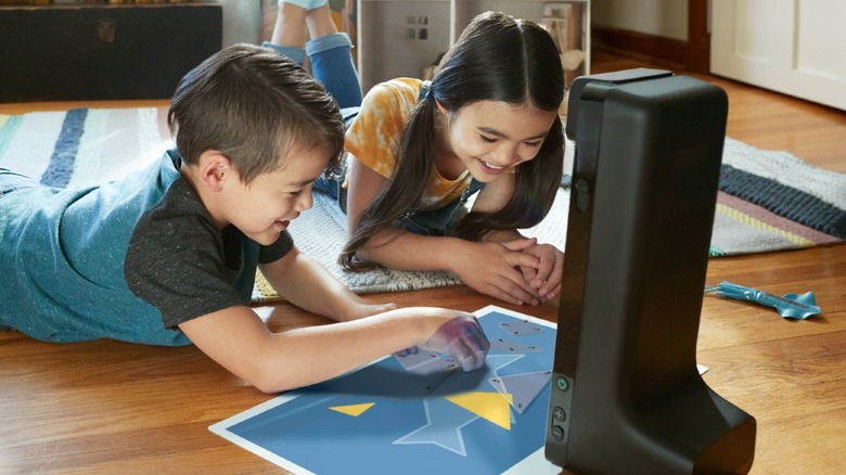 Two kids playing Amazon Glow