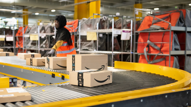 Amazon warehouse worker conveyor belt