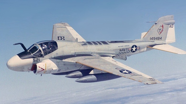 Grumman A-6 Intruder flying over clouds