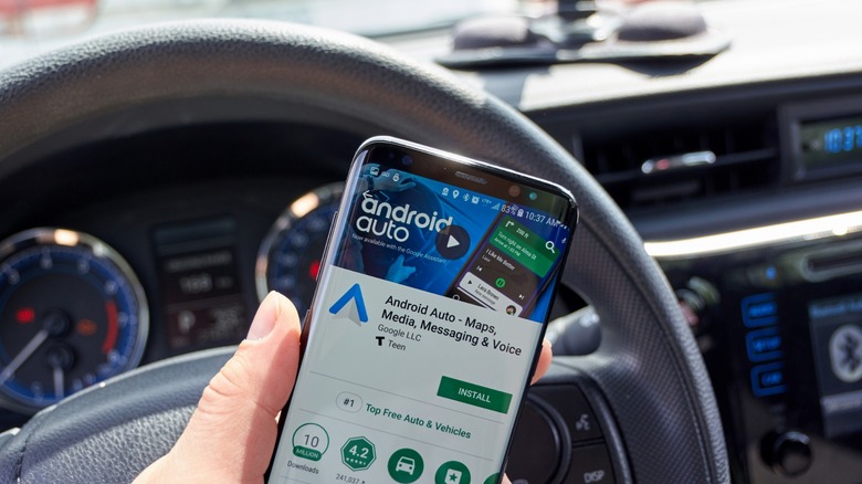Android Auto app on mobile device in car