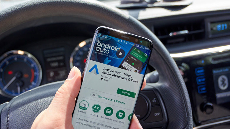 person installing Android Auto