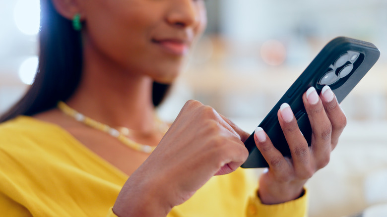 woman using iPhone