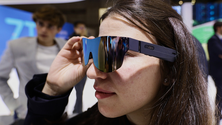 Close up of a person wearing Nubia Vision smart glasses