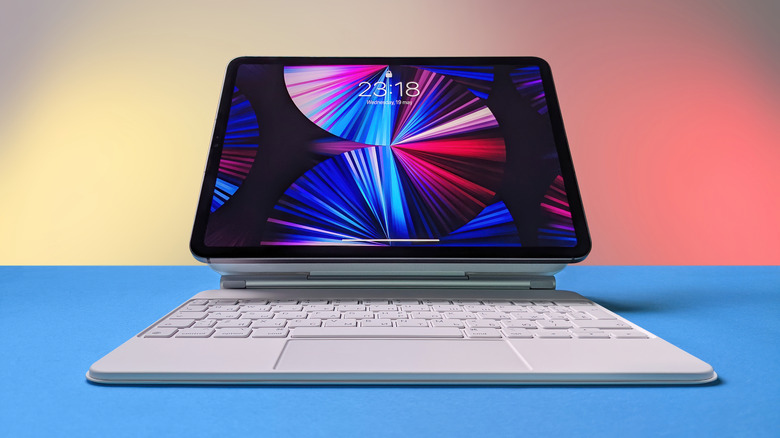 2021 iPad Pro 12.9-inch with Mini LED display placed on white Apple Magic Keyboard