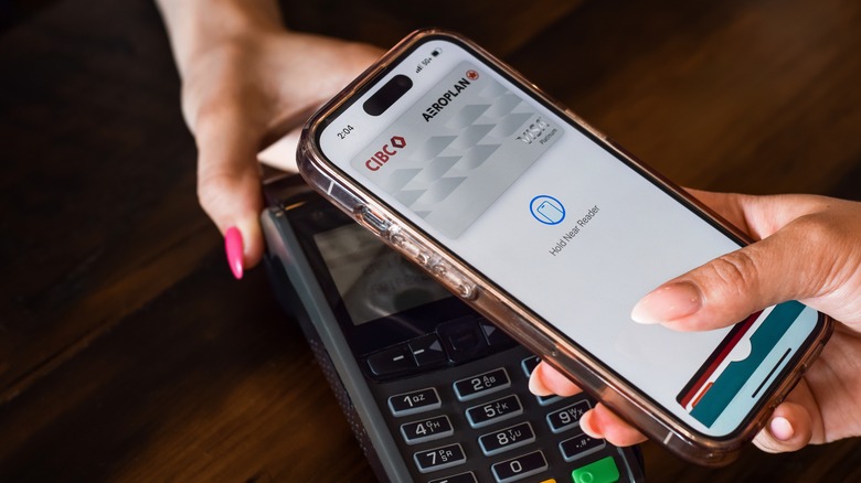 Person using Apple Pay for mobile payment